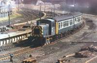 <I>This beats the docks</I>. Birkenhead's Class 03 shunter 03189 performs shuttle duties with a Derby DMU, from the station to the shed, at a Steamport Southport Open Day. As it runs past the former excursion platforms the coal depot sidings, still open at this time, can also be seen. The shunter remained in BR service until 1986, has since been preserved and can be seen at the Ribble Steam Railway in Preston. <br><br>[Mark Bartlett 11/09/1982]