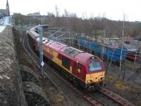 The 10.04 (Tuesdays & Fridays only) Mossend - Deanside <I>Enterprise</I> freight service approaching Sunnyside Junction behind EWS 67027 on 30 January 2009 via the freight-only line from Whifflet South Junction. This is thought to be the only regular scheduled service currently routed over the former CGU Clydebridge Viaduct.<br>
<br><br>[Andy Kirkham 30/01/2009]