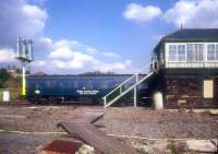 The former signal box at Cudworth, South Yorkshire, photographed circa 1986, with a Doncaster - Manchester Victoria route learning special standing alongside. <br>
<br><br>[Ian Dinmore //1986]