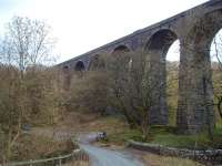 The imposing Dent Head viaduct carries the Settle and Carlisle line over the small beck that becomes the River Dee. This picture looks north and the unclassified Dentdale road climbs behind the camera before swinging under the line to join the Hawes to Ingleton Road. Map Ref SD 776843<br><br>[Mark Bartlett 31/01/2009]