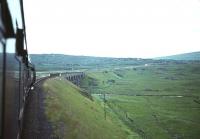 Shortly after leaving Gatehouse of Fleet station, heading east on <i>The Port Road</i>, the railway crossed a brace of viaducts spanning the two main tributaries of the Fleet. First came Big Water of Fleet viaduct, followed closely by the viaduct over its main tributary, Little Water of Fleet, pictured here from an eastbound train in the early 1960s. While its big brother still stands, this smaller of the two viaducts was subsequently blown up by the Army as a training exercise.<br>
<br><br>[Robin Barbour Collection (Courtesy Bruce McCartney) //]