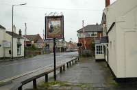 A suitable sign outside a pub with Bedlington South box in the background. The station was to the left.<br><br>[Ewan Crawford 26/06/2004]