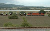 A 60 passes the time of day at Margam Moors Junction in September 2006 with some strip coil from Port Talbot Steelworks.<br><br>[Ewan Crawford 13/09/2006]