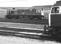 27002 seen in the yard at Carstairs on 22 April 1981 with the nose of a stabled class 47 in the foreground.<br>
<br><br>[Peter Todd 22/04/1981]