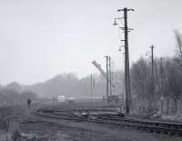 View north over the remains of Oakley Yard in 1987 with tracklifting in progress. The yard's primary function latterly was the handling of exchange traffic to and from Comrie Colliery.<br><br>[Bill Roberton //1987]