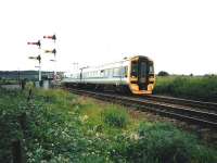 158 720 heads north at Larbert Junction in July 1996.<br>
<br><br>[David Panton /07/1996]