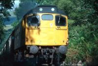 A Glasgow bound class 27 with a West Highland Line service near Faslane in August 1980.<br>
<br><br>[Johnny Trippick /08/1980]