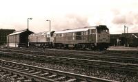 Locomotives 31234 and 47079 (formerly D1664) <I>G J Churchward</I> stand at the Swindon stabling point in March 1983. The class 47 had carried the name <I>George Jackson Churchward</I> until approximately 4 years previously (see image 3236) but, for some reason (anyone know why?) by 1980 the full name of the former CME of the Great Western Railway had been reduced to initials by BR. No 47079 was subsequently rebuilt as 57029 and became part of the DRS fleet from December 2007.<br><br>[Peter Todd /03/1983]