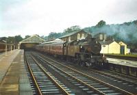 A neglected looking Fairburn 2-6-4T no 42680 prepares to take a train out of Windermere station in 1964. The locomotive was finally withdrawn from Carnforth shed in March the following year and made its last journey to Drapers of Hull shortly thereafter.<br>
<br><br>[Robin Barbour Collection (Courtesy Bruce McCartney) //1964]