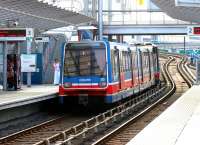 A Stratford - Crossharbour service pulls away from platform 3 at Poplar station on the London Docklands Light Railway system in July 2005.<br><br>[John Furnevel 21/07/2005]