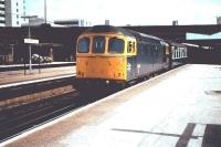 33204 with a westbound train at Southampton Central in 10 June 1983. 33204 was one of the 12 members of the class built 7 inches narrower than the standard design in order to cope with the reduced clearances on the Hastings line. The 12 were, perhaps inevitably, dubbed <I>Slim Jims</I>. <br>
<br><br>[Colin Alexander 10/06/1983]