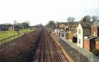 Looking west over the former Dinton station (closed 1966), on the Salisbury to Exeter main line, in February 1992. While it still appears to be double track, the right hand line (the old up line) was only used by this time as a connection between the RAF site at Dinton and the RAF site at Chilmark to the west. Both had their own internal narrow gauge systems and there were trans-shipment sheds to move <I>supplies</I> between standard gauge and narrow gauge waggons.<br><br>[John McIntyre 27/02/1992]