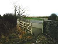 Looking towards the former station at Elliot Junction in March 1999. View is over the site of the level crossing at the start of the Carmyllie branch.<br><br>[David Panton 15/03/1999]