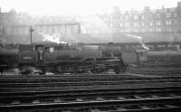 View south across the ECML at St Margarets shed in February 1965 with the usual haze hanging over London Road. 64A residents on shed that day included Standard Class 4 2-6-4T 80022 and B1 4-6-0 61099 in the right background alongside the coaling stage. <br><br>[K A Gray 06/02/1965]
