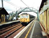 A North Berwick - Edinburgh service pulls into Drem in July 2002 formed by emu 305 517. <br><br>[David Panton /07/2002]