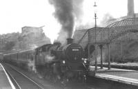 Standard class 4 2-6-4T no 80001 calls at Port Glasgow with a westbound service c 1965. Note the former footbridge and the bay platform that once handled Wemyss Bay services. <br><br>[Robin Barbour Collection (Courtesy Bruce McCartney) //1965]