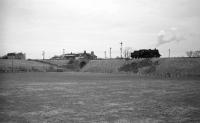 BR Standard class 4 2-6-0 no 76050 on the embankment carrying the Jedburgh branch just south of Roxburgh station in 1964.<br><br>[Robin Barbour Collection (Courtesy Bruce McCartney) 10/02/1964]