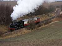 Caley tank 55189 with a mixed train does a run past for a photo charter on the approach to Birkhill station.<br><br>[John Robin 24/02/2009]