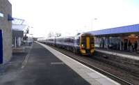 A class 158 forms a 5 coach train with a Class 170 on a Sunday service to Dundee, seen at Kirkcaldy on 22 February. This mixed-stock configuration is quite common on trains from Edinburgh up the East Coast (more common that 2 x 170s) and is the usual arrangement for the two sets needed for the Edinburgh to Dundee stopping services on Sunday. The building on the left houses the newly commissioned lift to street level and booking office and was many months in construction. The building on the Down platform (right) dates from 1962 and is in the boxy style later used in the Glasgow suburban station rebuilding.<br><br>[David Panton 22/02/2009]