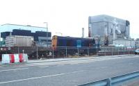 Flasks arrive at the Heysham Power Stations, having been hauled down the line from Morecambe by DRS 20304. Heysham 1 is the building on the right of the picture, with Heysham 2 on the left, the latter accessed by a short branch worked by a Sentinel diesel shunter. The recently approved life extension of Heysham 2 to 2030 will keep the rail connections in use until at least that date. <br><br>[Mark Bartlett 16/01/2007]