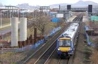 Looking east towards Edinburgh Park Station on 25 February as 170 451 passes the piers of the new tramway bridge under construction as well as new electrification mast bases.<br><br>[Bill Roberton 25/02/2009]