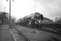 Stanier <I>Coronation</I> Pacific no 46255 <I>City of Hereford</I> casts a giant shadow over Carlisle after emerging from below Victoria Viaduct soon after restarting the 10-coach RCTS <I>Three Summit Tour</I> on 30 June 1963.  The locomotive took this leg of the special north as far as Carstairs having taken over the train at Carlisle from A4 no 60023 <I>Golden Eagle</I>. [See image 29438]<br>
<br><br>[Robin Barbour Collection (Courtesy Bruce McCartney) 30/06/1963]