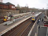 334020 has arrived in the bay at Springburn from Dalmuir while 170456 runs in on a service from the Cumbernauld line, going forward to Glasgow Queen St HL.<br><br>[Mark Bartlett 26/02/2009]