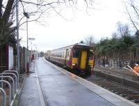 The camber at Dunlop station can make alighting a slightly queasy experience. The driver of a Carlisle to Glasgow 156 495 chats with workers building the new platform to serve the new long loop, or rather whopping 5-mile extension of the existing Lugton loop, which will extend south past Stewarton. The current long single section between Lugton and Kilmarnock limits frequency and some passenger trains are halted in the manually signalled Lugton loop. A half-hourly service is expected to start from the December 2009 timetable when work should be completed. Isolated stretches of the second track are already in place.<br>
<br><br>[David Panton 26/02/2009]