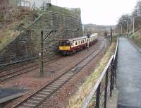 An Outer Circle service formed by 314203 leaves Mount Florida heading towards Cathcart.  With footbridges at each end of the island platform, and this public footpath alongside the line, there are plenty of vantage points here if not a lot of variety among the trains.<br><br>[Mark Bartlett 26/02/2009]