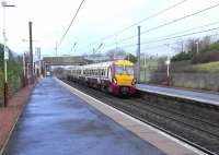 A Glasgow Central to Largs semi-fast service, formed by unit 303 024, calls at Dalry on 26 February 2009.<br><br>[David Panton 26/02/2009]