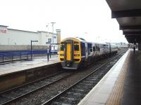 A York to Blackpool North service, formed by Northern promotional liveried 158790,  calls at Blackburn in this view towards Preston. The <I>feathers</I> on the signals are for the junction with the line to Darwen and Bolton.<br><br>[Mark Bartlett 03/03/2009]