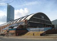 The former CLC 1880 Manchester Central station with its graceful arched roof of simialr design to St Pancras and St Enoch. After closure in May 1969 the station was first used as a car park before becoming the Greater Manchester Exhibition and Conference Centre (G-Mex). It has recently been rebranded and is once again known as Manchester Central, and, although the trains have long gone, nowadays it is well served by the Metrolink tram system which runs past the main entrance.<br><br>[John McIntyre 05/03/2009]