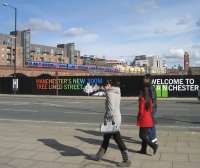 Looking north-east from Albion Street, Manchester, towards the urban railway viaduct that stretches between Deansgate (to the left) and Oxford Road (to the right) and on to Piccadilly as a First TPE service heads west on 5 March 2009. This busy section of railway is a significant bottleneck in Manchester. <br>
<br><br>[John McIntyre 05/03/2009]