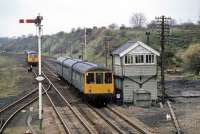 A Saturday morning Ely - Norwich service slows for the call at Wymondham on 21st April 1979. Halted on the up main line and preparing to reverse onto the down main (so as to gain access to the Dereham branch) is the <I>Fakenham Flyer</I> special DMU charter. The <I>Flyer</I> was to be the first passenger train to reach Fakenham since 1964. It was also destined to be the very last as Fakenham was closed to all traffic the next year. Wymondham station was then a rather run down unstaffed halt. Today, a visit is rewarded by the <I>Brief Encounter</I> restaurant and railwayana exhibition that occupies the premises.  <br><br>[Mark Dufton 21/04/1979]