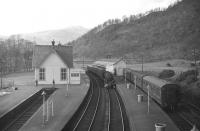 Looking west over Callander station in mid 1965 with Black 5 no 45423 about to leave with the 1.30pm to Glasgow, Buchanan Street. The station and line closed in November of that year. [See image 22017] for the same view 5 years later.    <br><br>[Robin Barbour Collection (Courtesy Bruce McCartney) 01/02/1964]