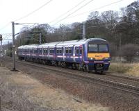 Eastbound 322 481, heading for North Berwick, pictured from the trackbed of the former Haddington branch at Longniddry on 7 March 2009.<br><br>[David Panton 07/03/2009]