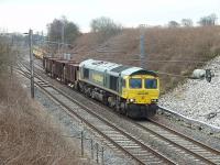 Having been held in the down loop at Oubeck to allow a Pendolino, a TPE 185 and a Voyager to pass, Freightliner 66595 eases its infrastructure train back onto the main line and continues its journey northwards.<br><br>[Mark Bartlett 11/03/2009]