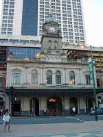 Brisbane Central Railway Station dwarfed by modern tower blocks, as viewed from Ann Street. The tower was designed by English architect J. J. Clark.<br><br>[Beth Crawford 23/02/2009]