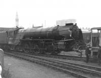 <I>'Just let me get this straight... you went away for a cuppa tea, and she was like this when you got back...'</I> 60123 <i>H A Ivatt</i> at St James Bridge, Doncaster en route to works following crash recovery in the aftermath of the Offord collision of September 1962. Given the projected lifespan of main line steam, the Pacific was deemed a write-off and became the first A1 to be scrapped, when she was cut up at Doncaster Works a short time later.  <br><br>[David Pesterfield /09/1962]