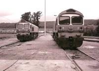 The virtually new Yeoman locomotives 59001 & 59004 stand side by side on shed at Merehead Quarry on Sunday 02 August 1987.<br><br>[Peter Todd 02/08/1987]