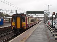 <I>The Cumbernauld Shuttle</I>, formed by 156435, is ready for another trip from the Hamilton line platform at Motherwell, passing Motherwell shed and Mossend Yard en route.<br><br>[Mark Bartlett 26/02/2009]