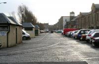 View east along what was an internal dock road (now Ocean Square) running between the site of the old West & East docks (now occupied by the Holiday Inn and the large Scottish Executive building) off to the left and the rear of the former warehousing facing onto Commercial Street (now converted to residential accommodation) on the right. The imbedded rails that ran between the docksides and the various warehouses have been left in place.<br>
<br><br>[John Furnevel 15/03/2009]