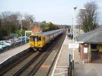 Freshfield station is close to the National Trust's Formby sand dunes area and popular with visitors, hence the party of ramblers on the Liverpool platform as 507005 pulls in on its way to Southport.<br><br>[Mark Bartlett 17/03/2009]