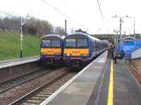 Class 322 services operating on the North Berwick route pass at Musselburgh station on 7 March 2009.<br><br>[David Panton 07/03/2009]