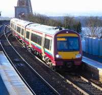 SPT uses 170s on only two of its routes, and more sets were delivered in SPT livery than could be needed on them, leading one to suspect they once had higher hopes. The consequence is that these sets frequently appear on services originating in Edinburgh and going nowhere near Glasgow. Here on 4 March 2009 an almost empty 170 472 comes off the Forth Bridge into North Queensferry station on a morning Fife circle working having passed busy commuter trains heading the other way in quick succession.<br><br>[David Panton 04/03/2009]