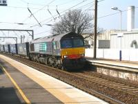 <I>Makes a change....</I> the returning  Tesco containers, ex-WHM Grangemouth, travelled via the ECML on Saturday 21 March 2009 as a result of weekend engineering work. The train, hauled by DRS 66424, is about to run through Prestonpans station at 1248 on its way south. <br>
<br><br>[John Furnevel 21/03/2009]