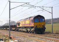 EWS 66150 on a Dalzell-Lackenby empty steel working, seen at Fullwood, between Carluke and Lanark Junction on 20 March. Previously a class 60 duty, almost all 60s are currently <I>stored</I> due to the recession.<br><br>[Bill Roberton 20/03/2009]