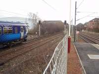 <I>Saltire</I> liveried Sprinter 156433 lays over on the branch behind the platform at Whifflet, thus clearing the main line for the <I>Cumbernauld Shuttle</I> in between being used for services to and from Glasgow Central. This view looks south towards Mossend and Motherwell. <br><br>[Mark Bartlett 26/02/2009]