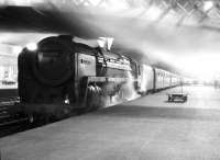 Britannia Pacific 70049 <I>Solway Firth</I> stands under the footbridge at an almost deserted Carlisle station, late one evening in the mid 1960s.<br><br>[Robin Barbour Collection (Courtesy Bruce McCartney) //]