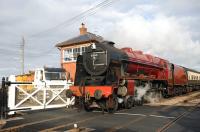 <I>Royal Scot</I> on the level crossing at Blue Anchor station on 25 March 2009.<br><br>[Peter Todd 25/03/2009]